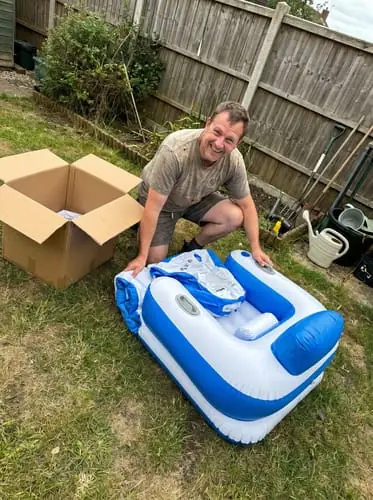 Happy customer unboxing the JetStream Lounger X2 in his garden